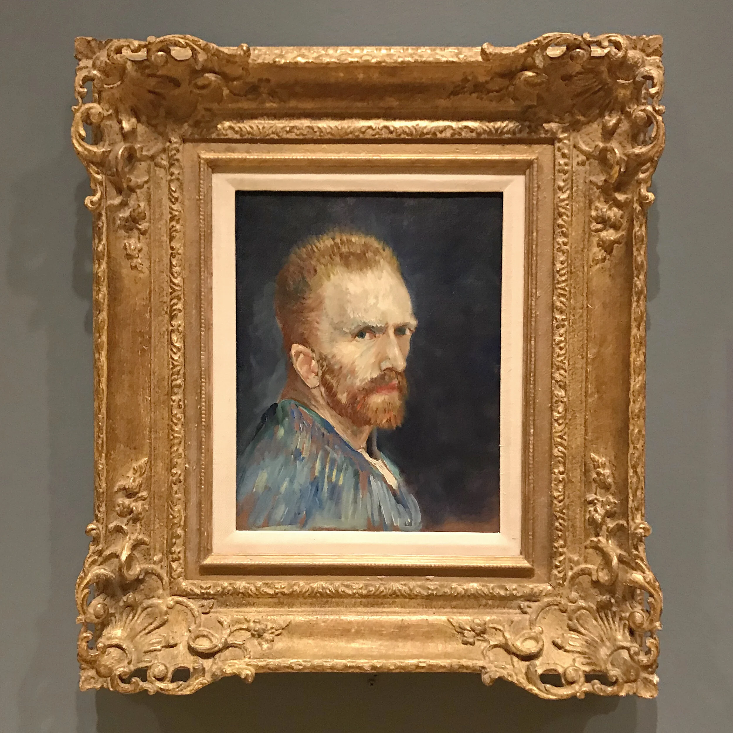 Self portrait in a snazzy gold frame.